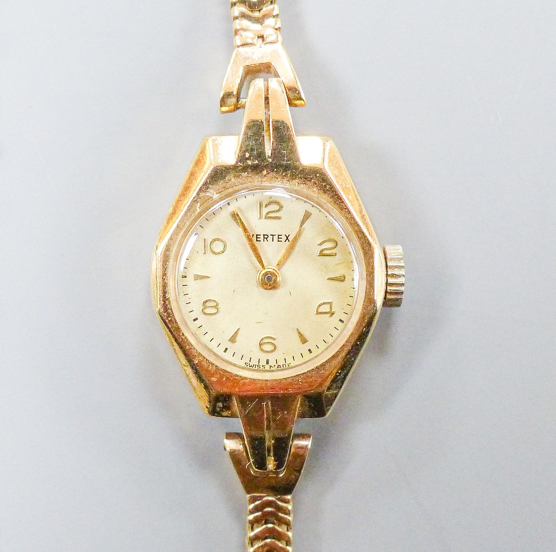 A lady's 9ct gold Vertex manual wind wristwatch on 9ct gold close flexible link bracelet, gross weight, 17.8 grams.